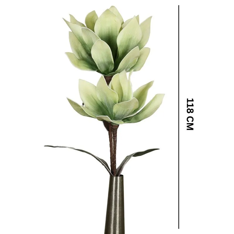 Artificial flower stick displayed in a tall vase beside books and a clock