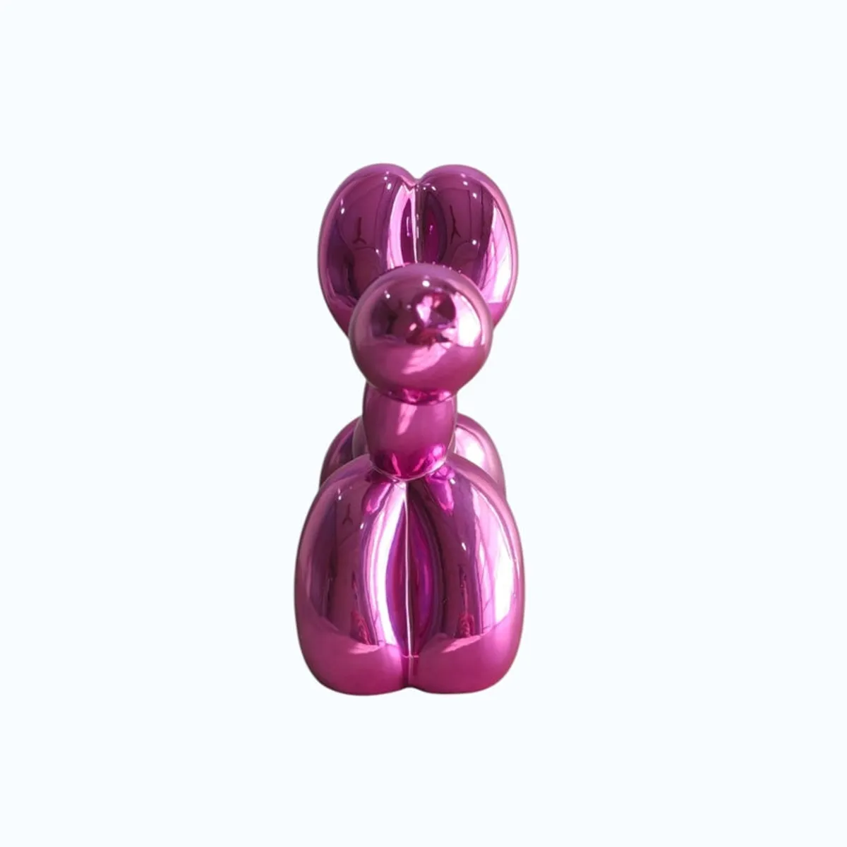 Front view of a shiny pink balloon dog showpiece on a plain light background.