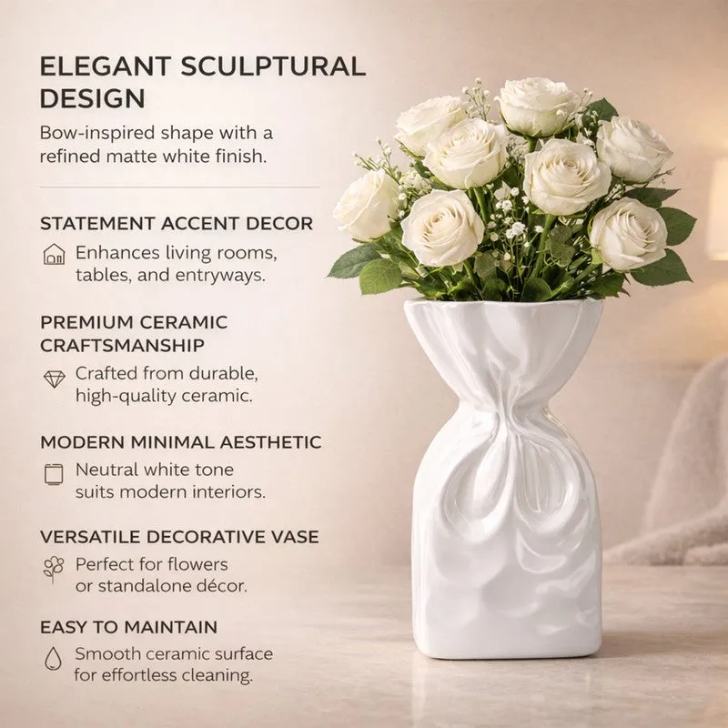 White sculptural vase with white roses beside printed product feature text