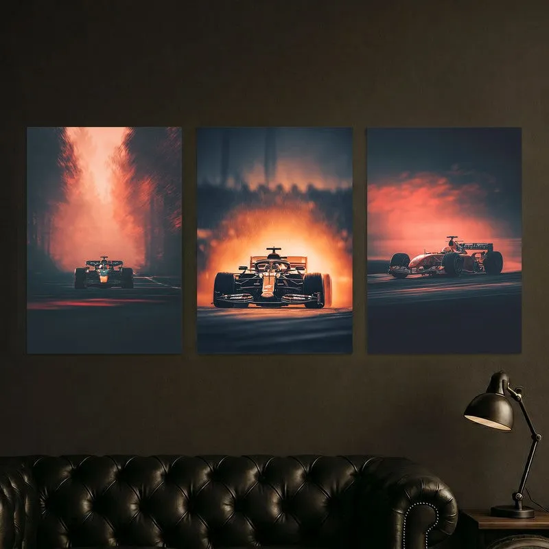 Three racing car posters arranged above a dark leather sofa