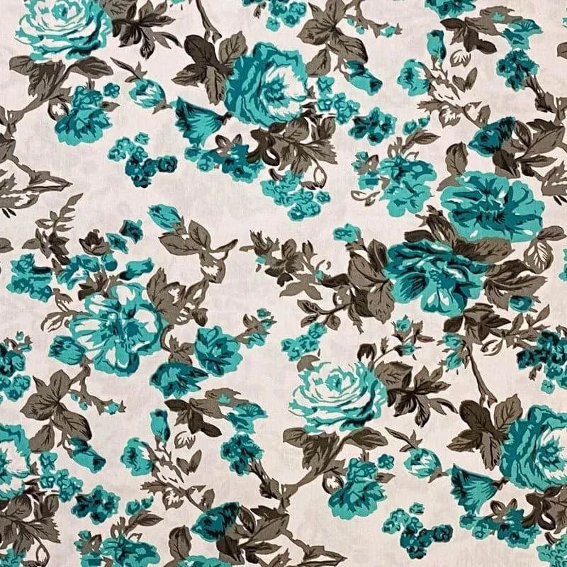 Close-up of teal and brown floral pattern on a cream bedsheet