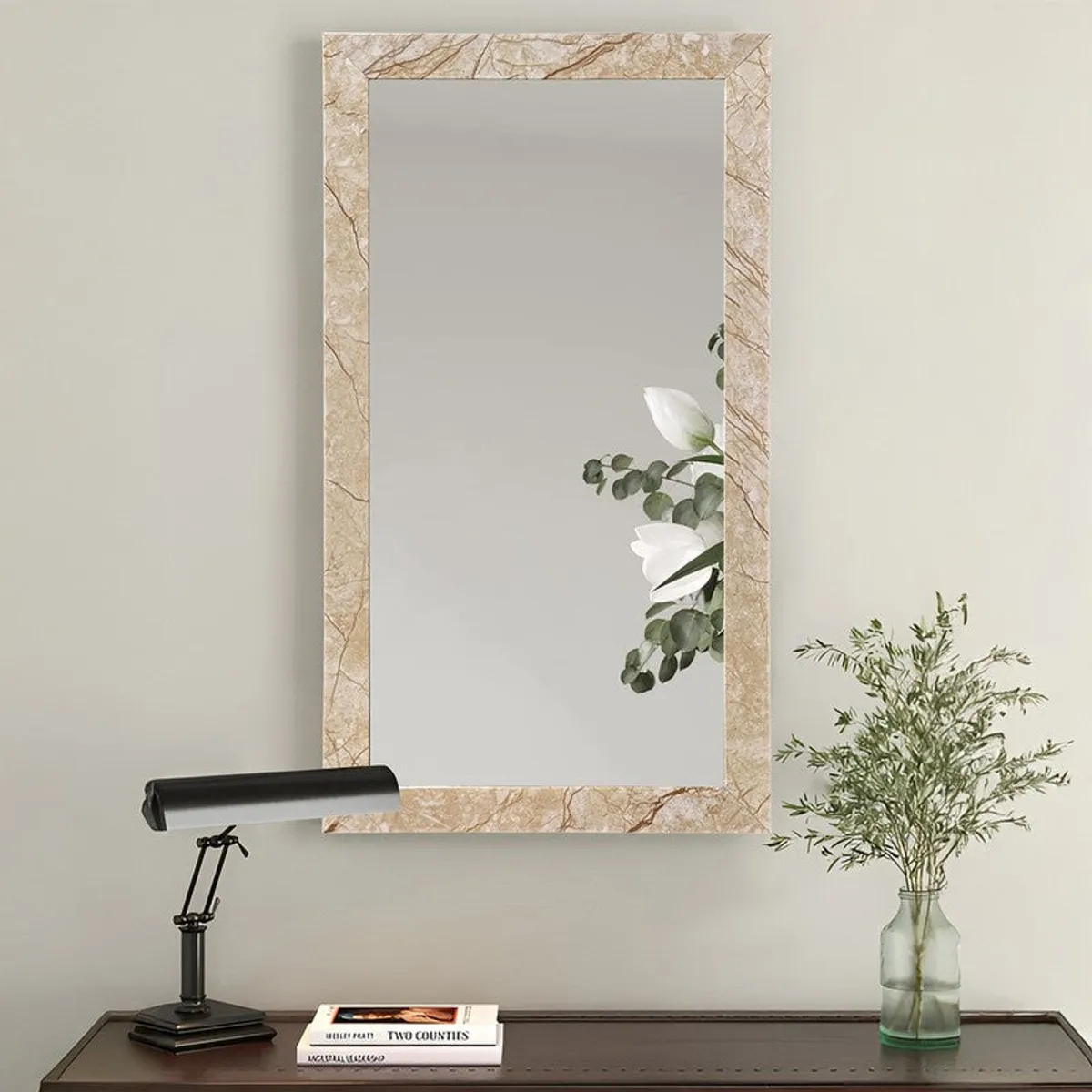 Beige marble-finish rectangular wall mirror displayed above a desk
