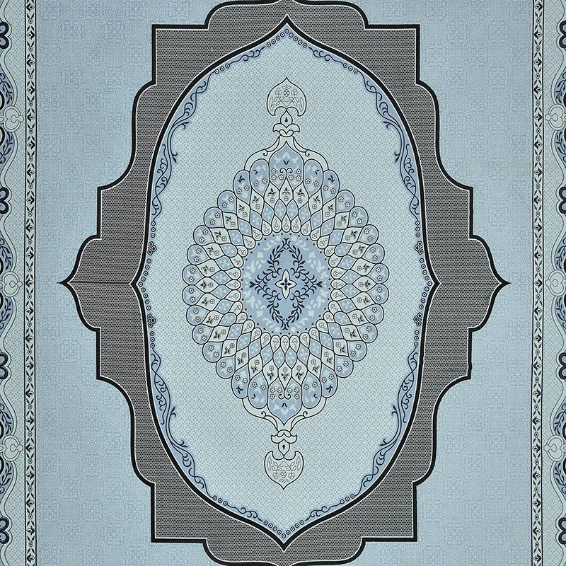 Close-up of the sky blue bedsheet showing the ornate central motif