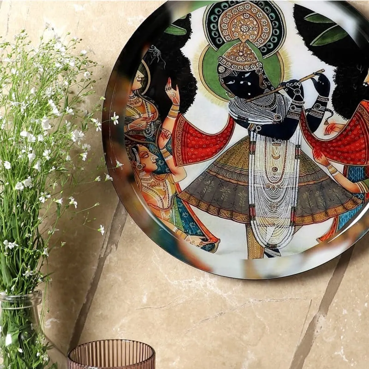 Close view of the multicolour spiritual artwork on a round wall plate