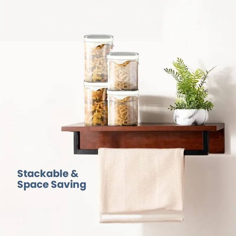 Stacked transparent storage jars with white lids demonstrating space-saving organisation.