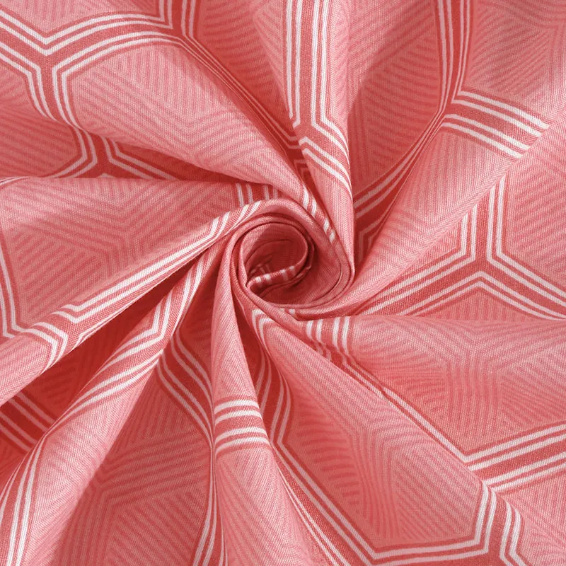 Close-up of pink geometric fabric gathered to show pattern