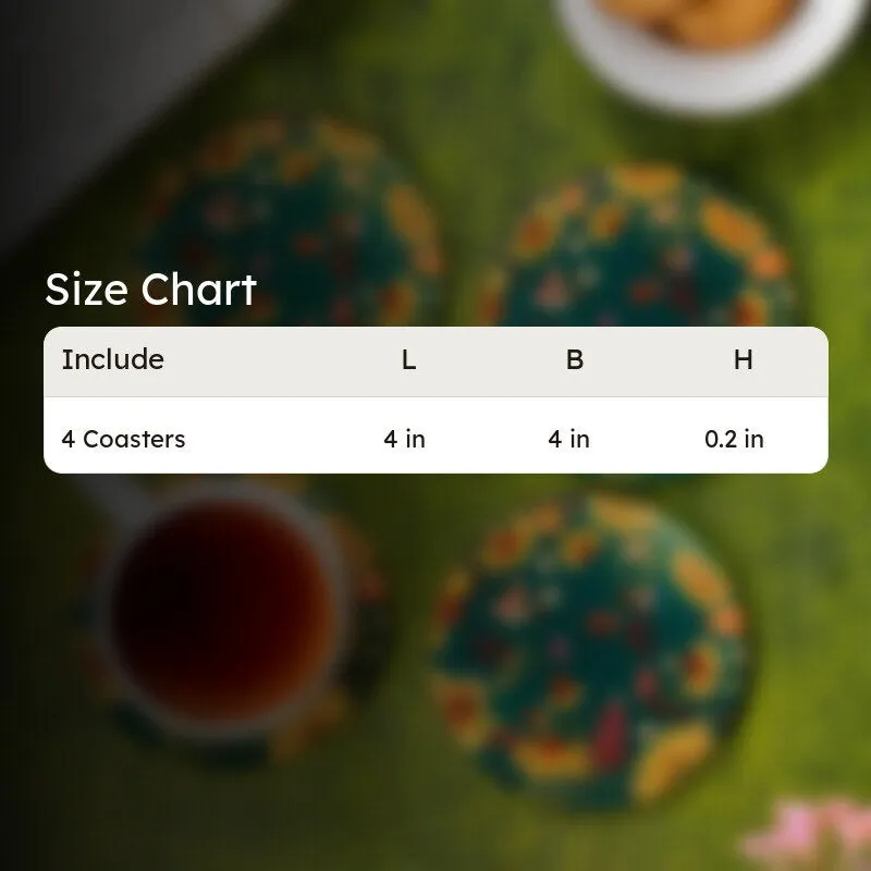 Blurred view of floral round coasters on a green tabletop with a teacup and cookies.