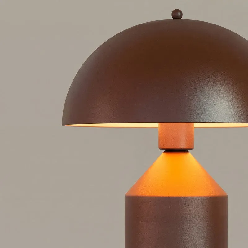 Close-up of the brown lamp's domed shade and angular geometric base