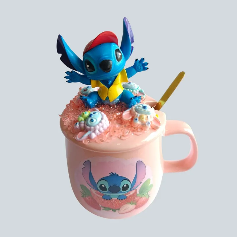 Front view of pink Stitch strawberry mug with ornate figurine lid and gold spoon