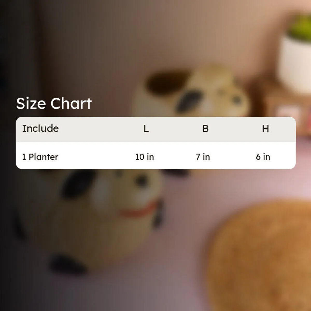 Sheep-shaped planter shown against a softly blurred indoor background.