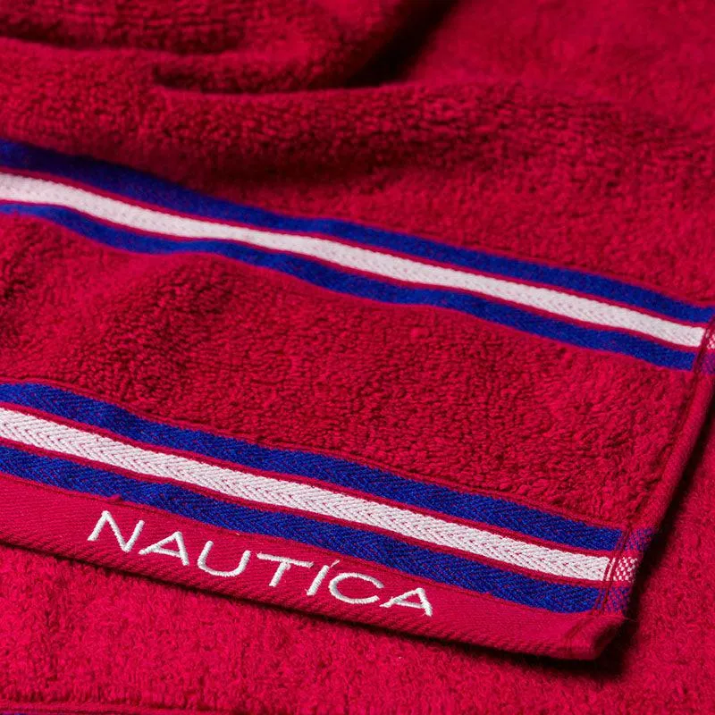 Detailed view of pink towel fabric with blue and white striped bands.