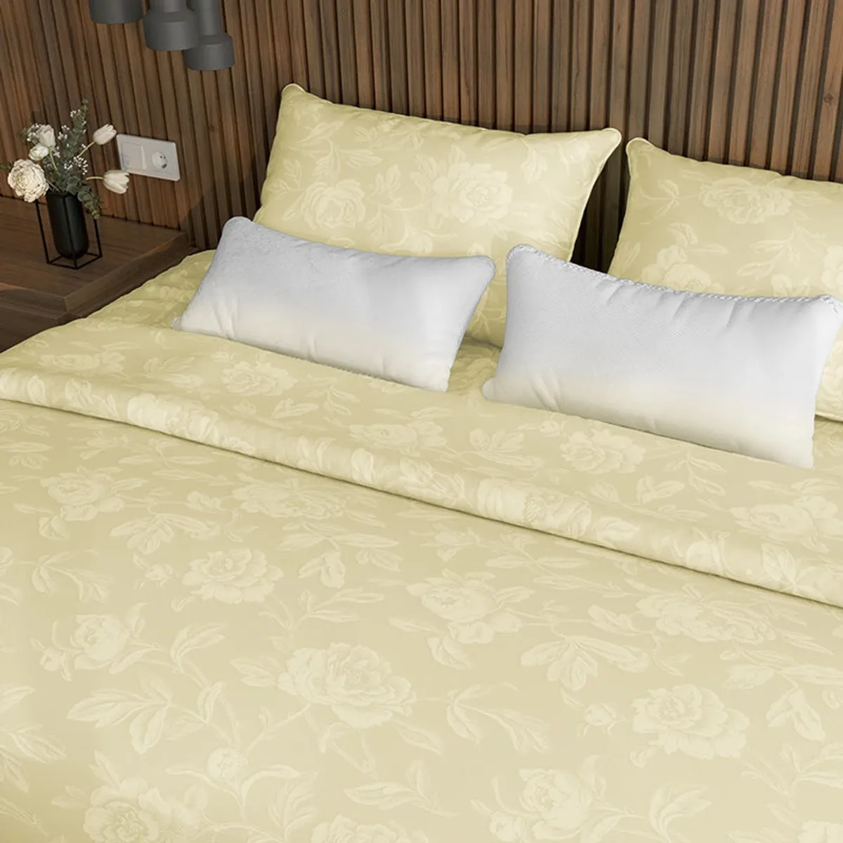 Floral ivory duvet cover folded across a neatly styled bed