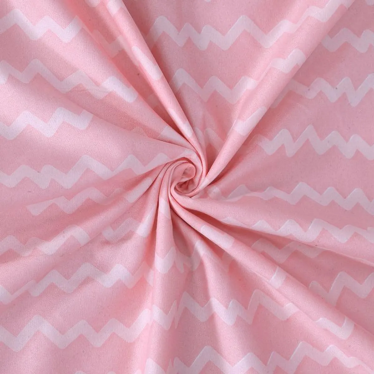 Close-up of pink fabric with white zigzag stripes