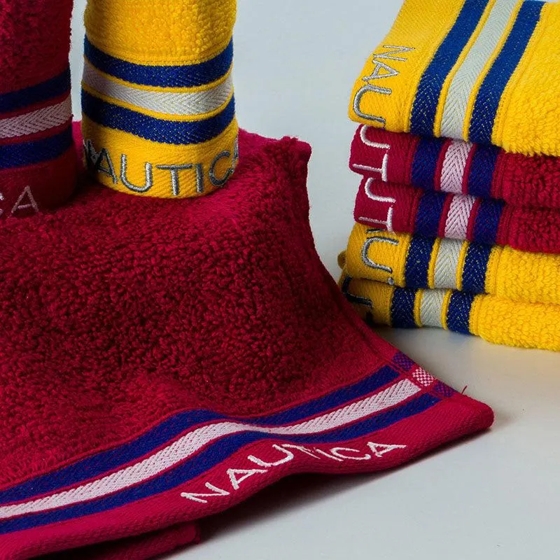 Close-up of burgundy and yellow towels with blue and white striped border