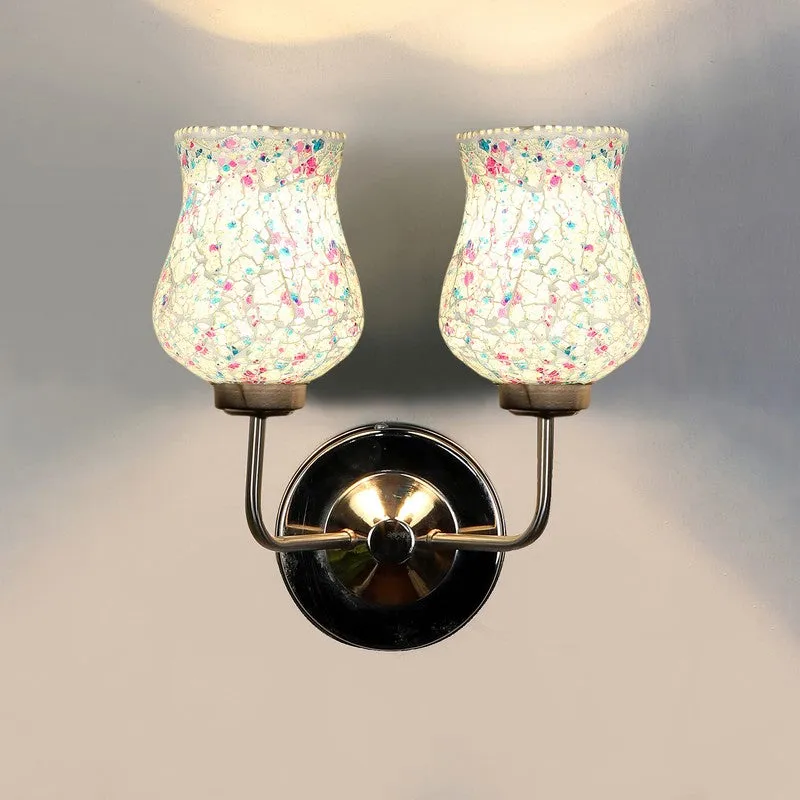 Lit front view of dual crackle glass wall lamp with warm glow