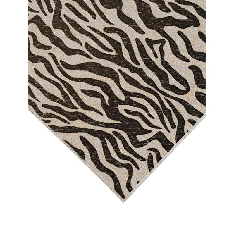 Corner view of the black and white patterned rectangular carpet