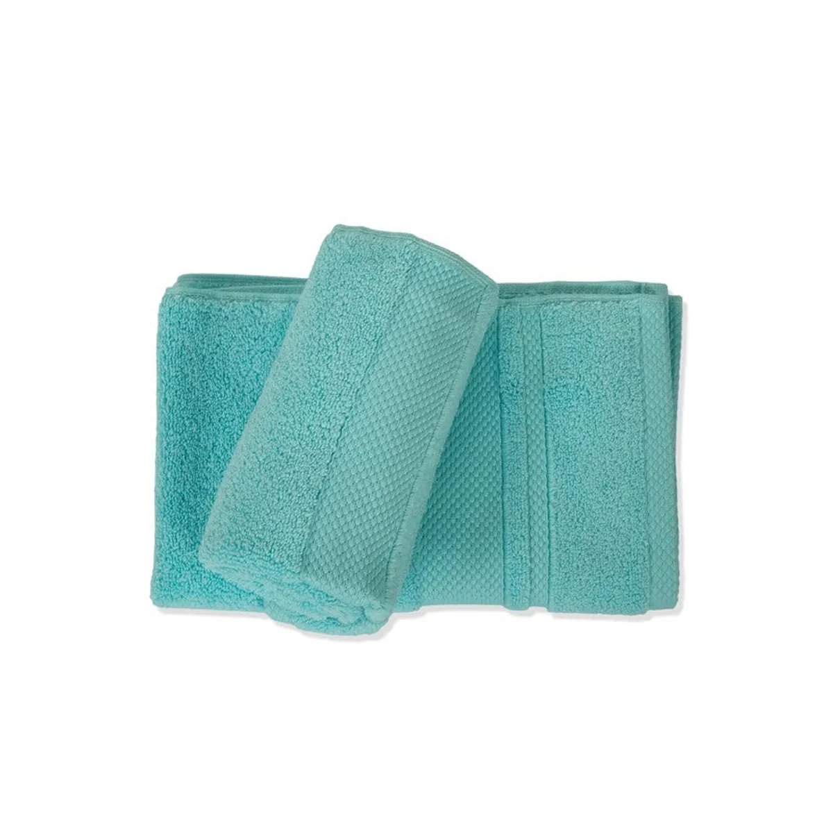 Two turquoise cotton towels folded and layered on a white background