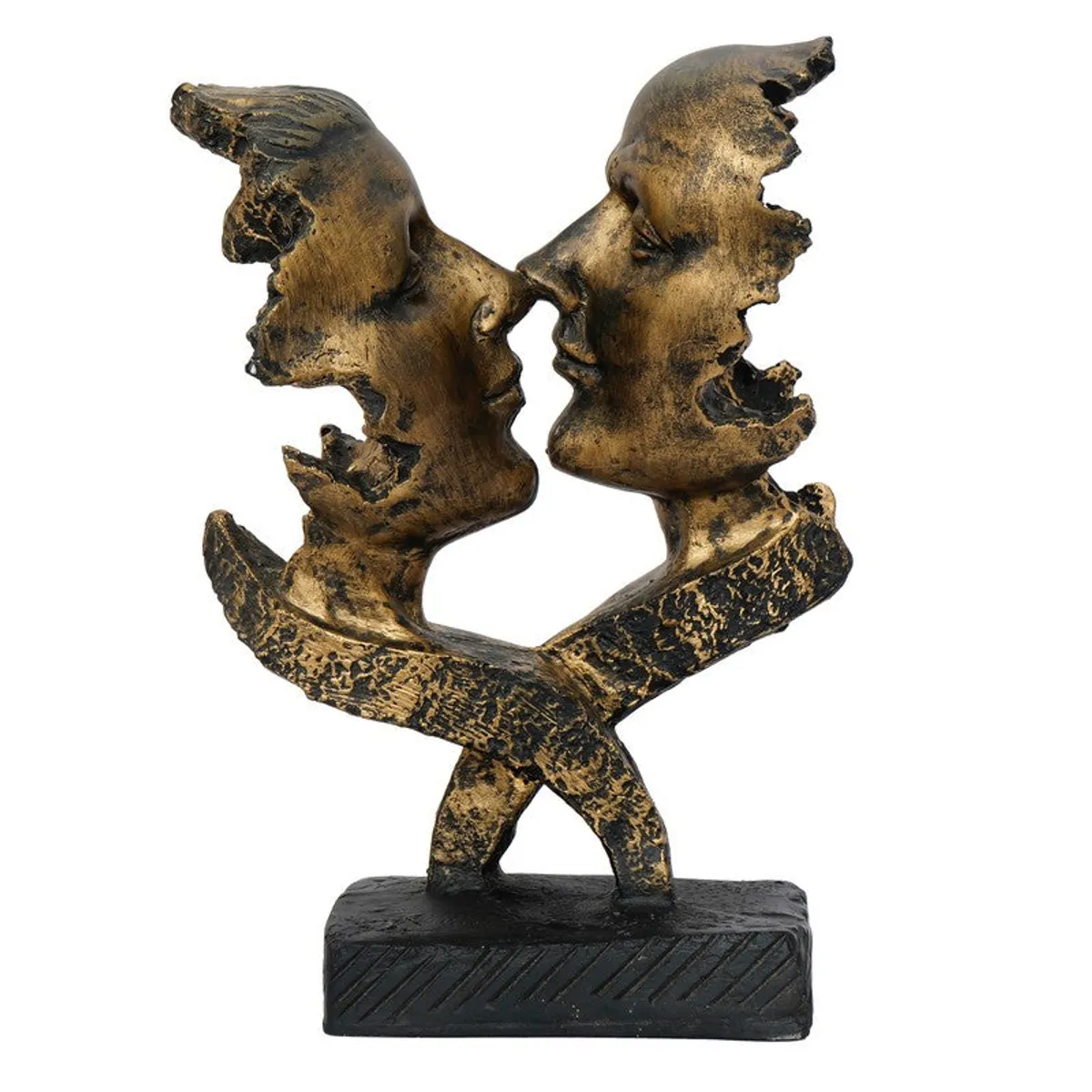 Side angle of a gold-toned abstract face figurine on a black base