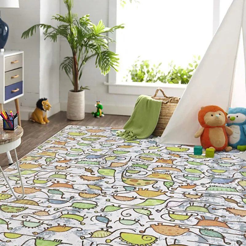 Kids carpet with playful dinosaur pattern in orange, yellow and green tones