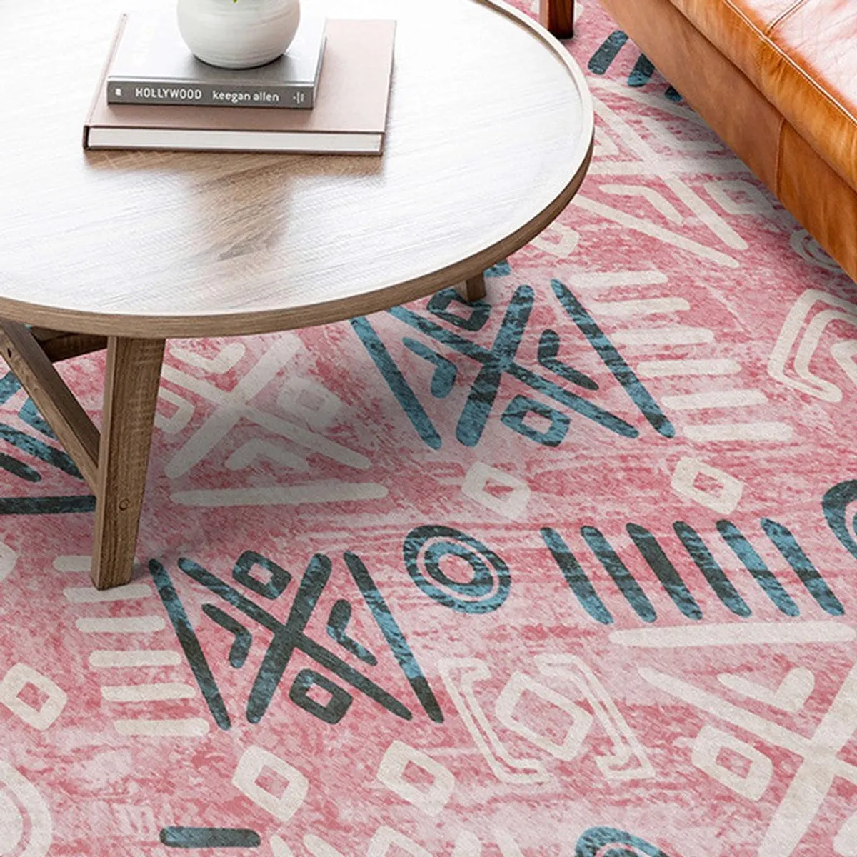 Close-up of pink carpet with large abstract motifs under a table