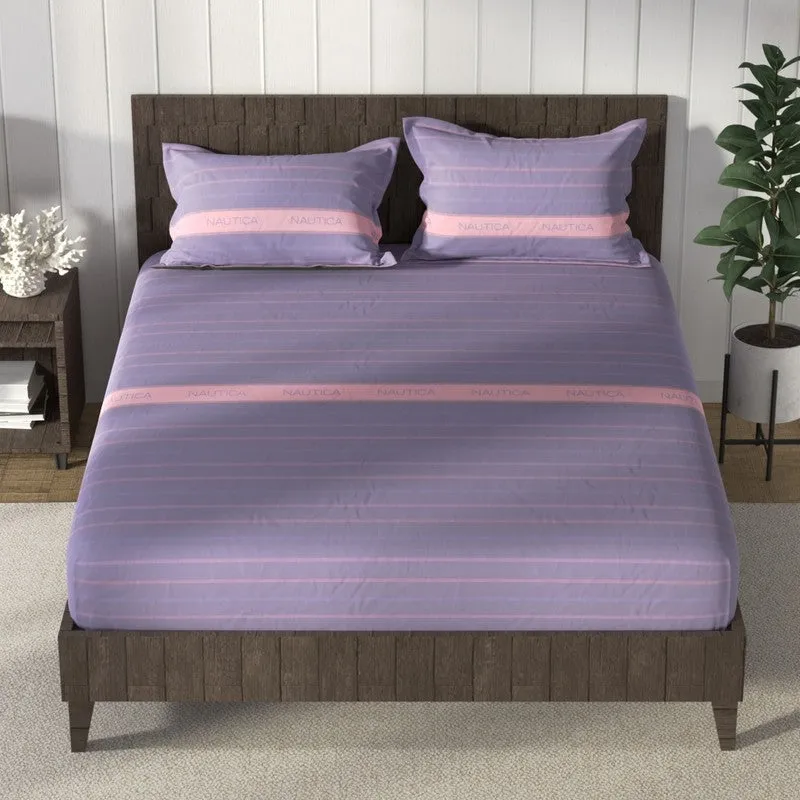 Front view of purple and pink striped bedsheet with two matching pillow covers