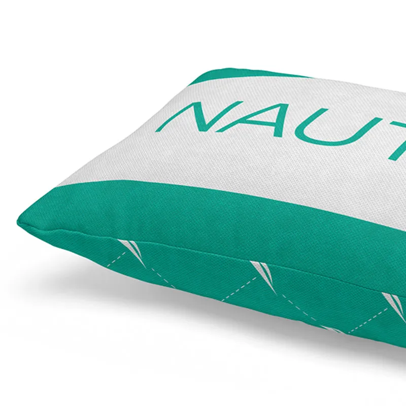 Close-up of teal and white cushion cover fabric, seams and printed NAUTICA lettering