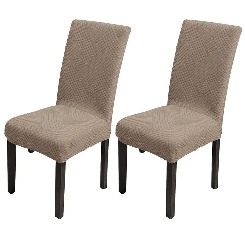 Pair of beige elasticated chair covers shown on two chairs