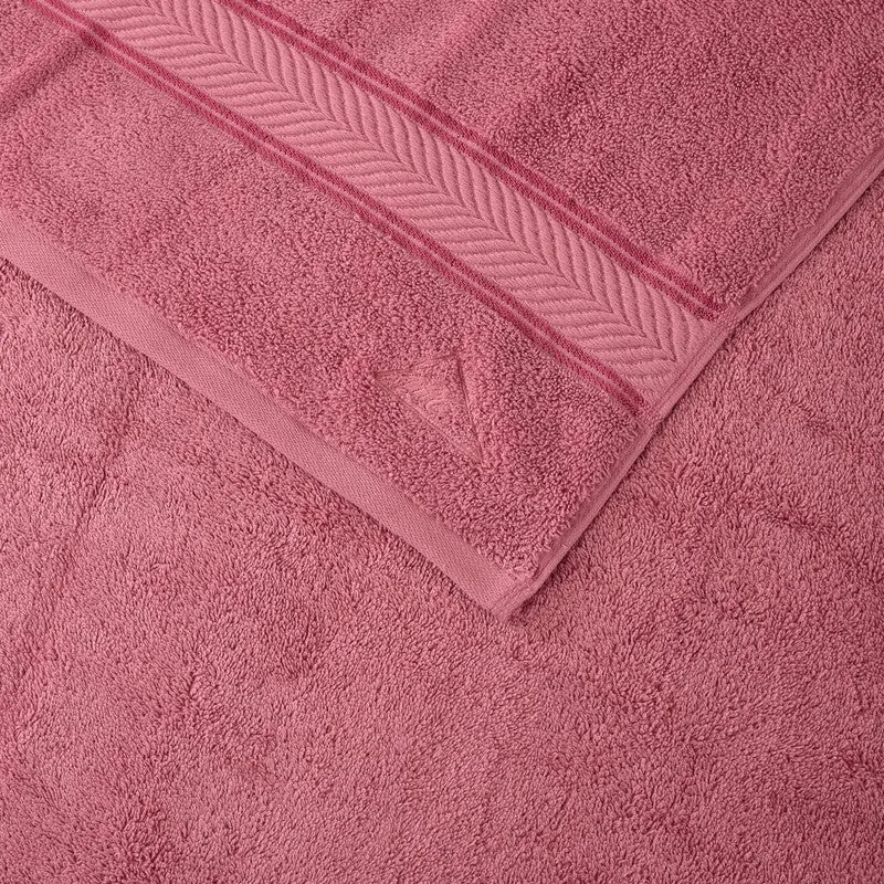Close-up of pink bath towel texture and border detail