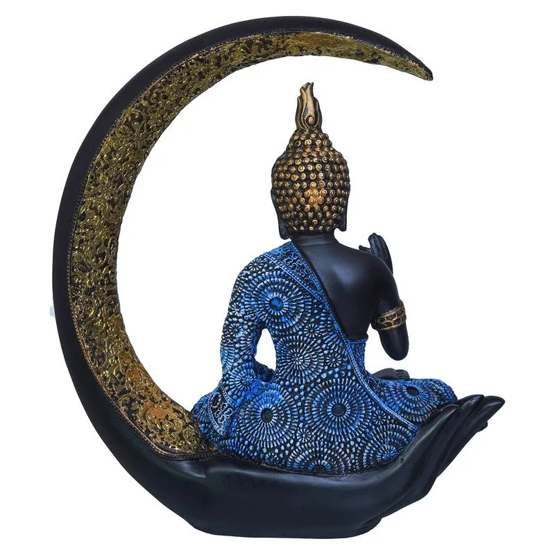 Rear view of Buddha idol showing blue patterned robe and gold crescent
