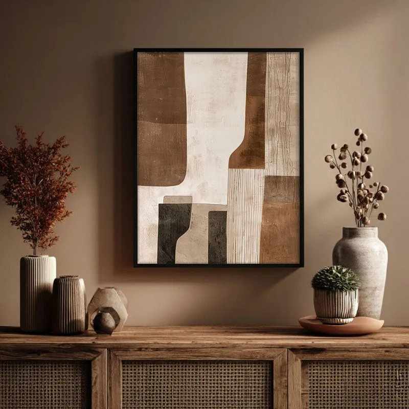 Framed abstract beige artwork displayed above a wooden console with vases and decor.