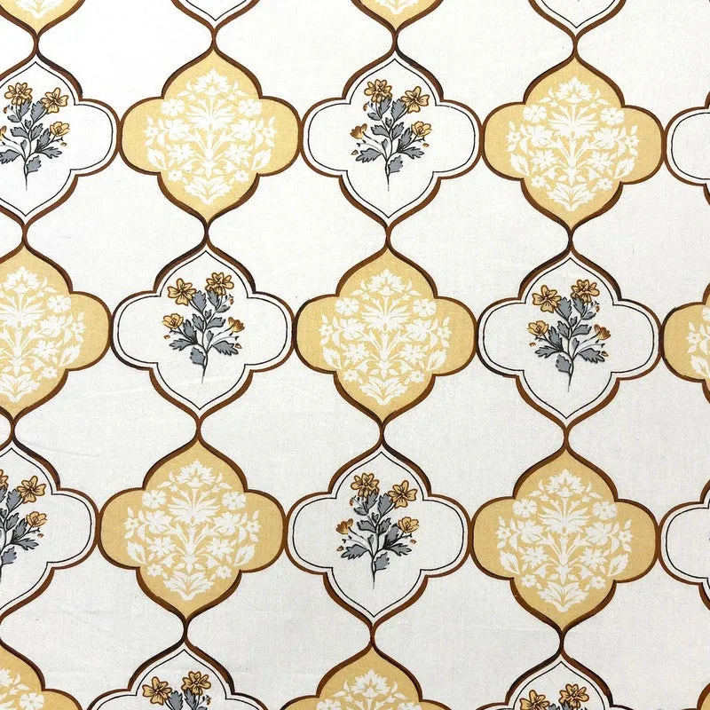 Close-up of yellow and off-white floral printed pattern on fabric