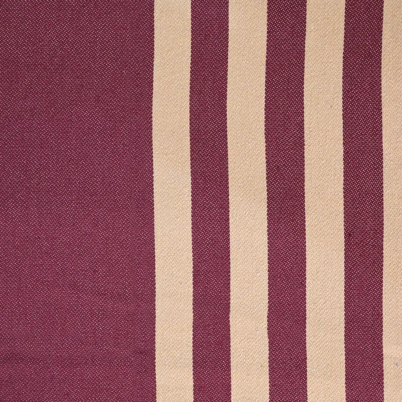 Close-up of the maroon and beige striped bedsheet fabric