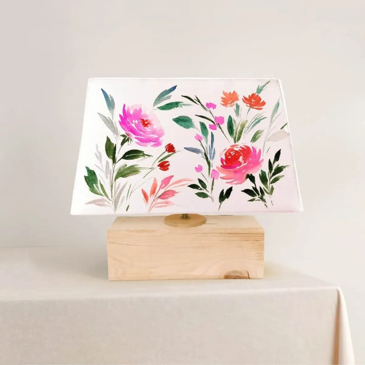 Multicolour floral fabric table lamp with a rectangular shade and light wooden base