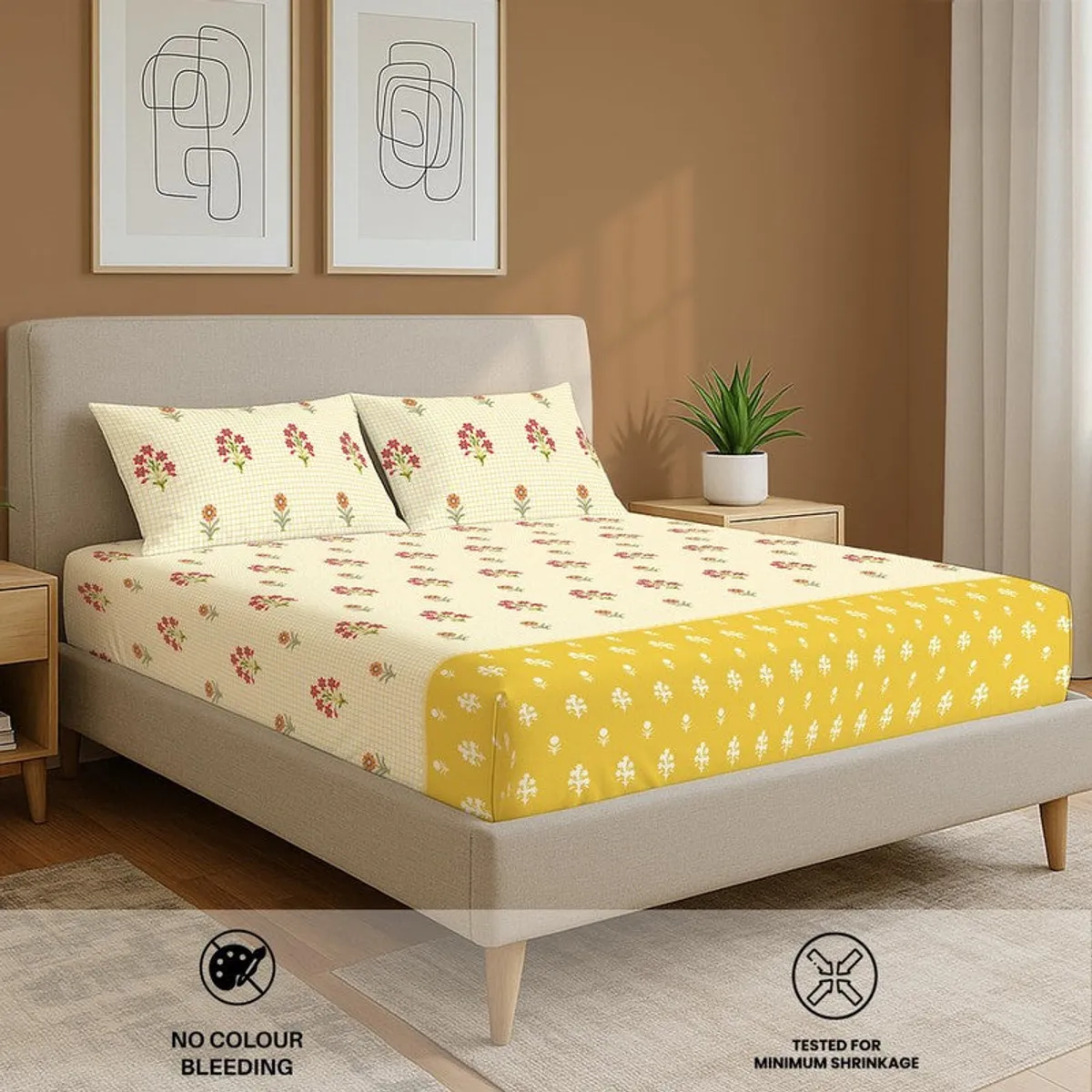 Yellow floral bedsheet set on a beige upholstered bed in a bedroom setting