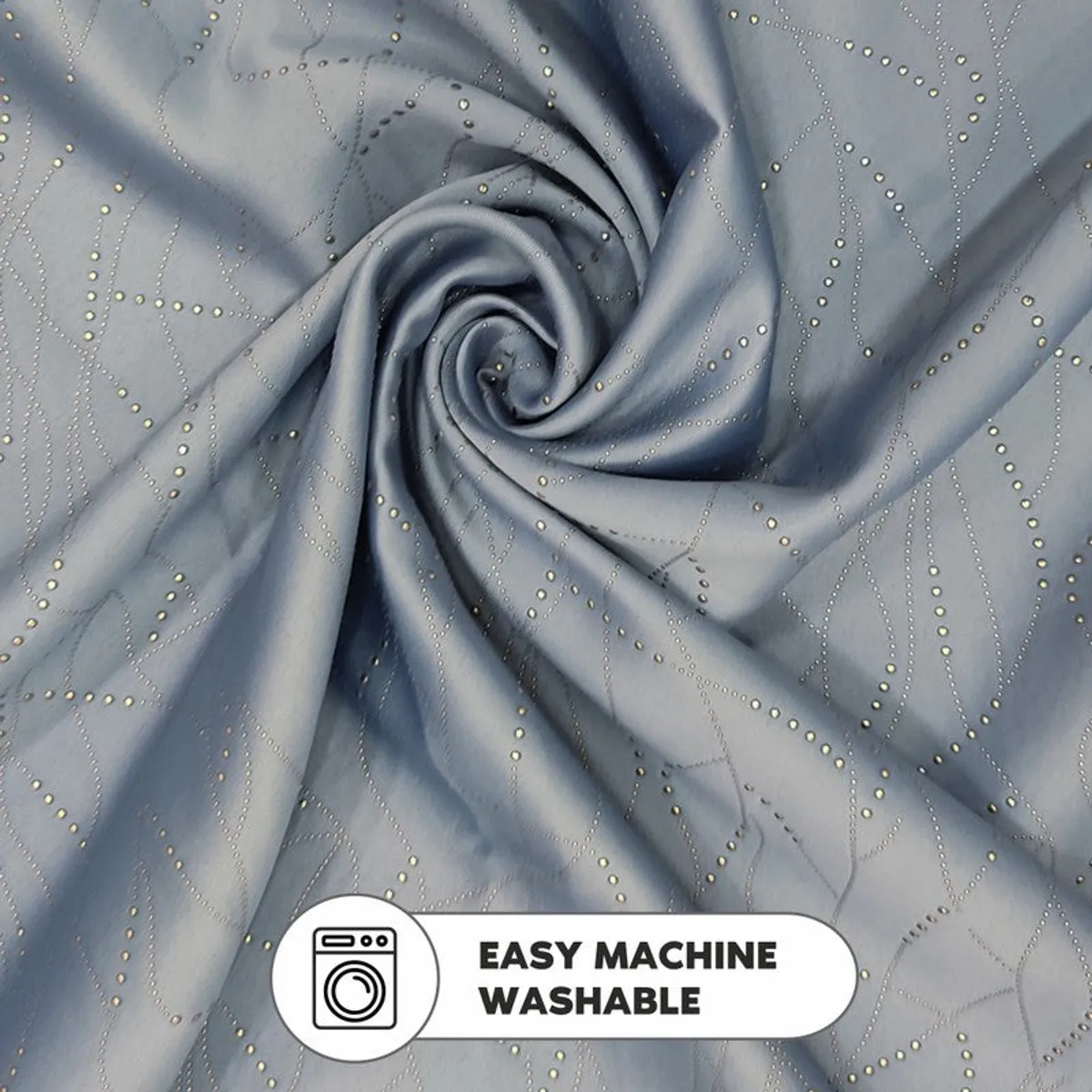 Close-up of silver metal curtain rings on grey patterned fabric