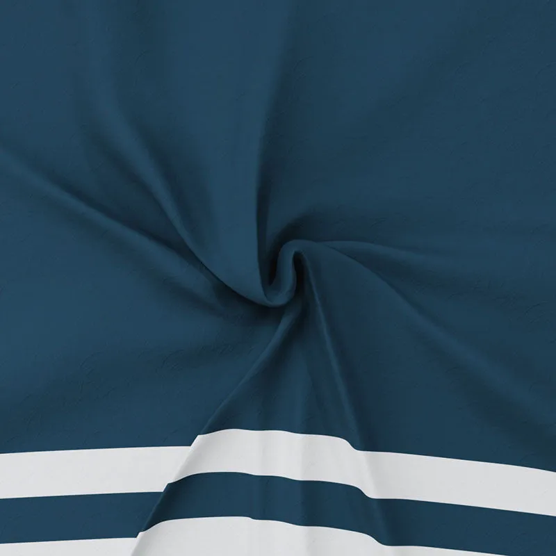 Close-up of softly draped navy blue cotton fabric