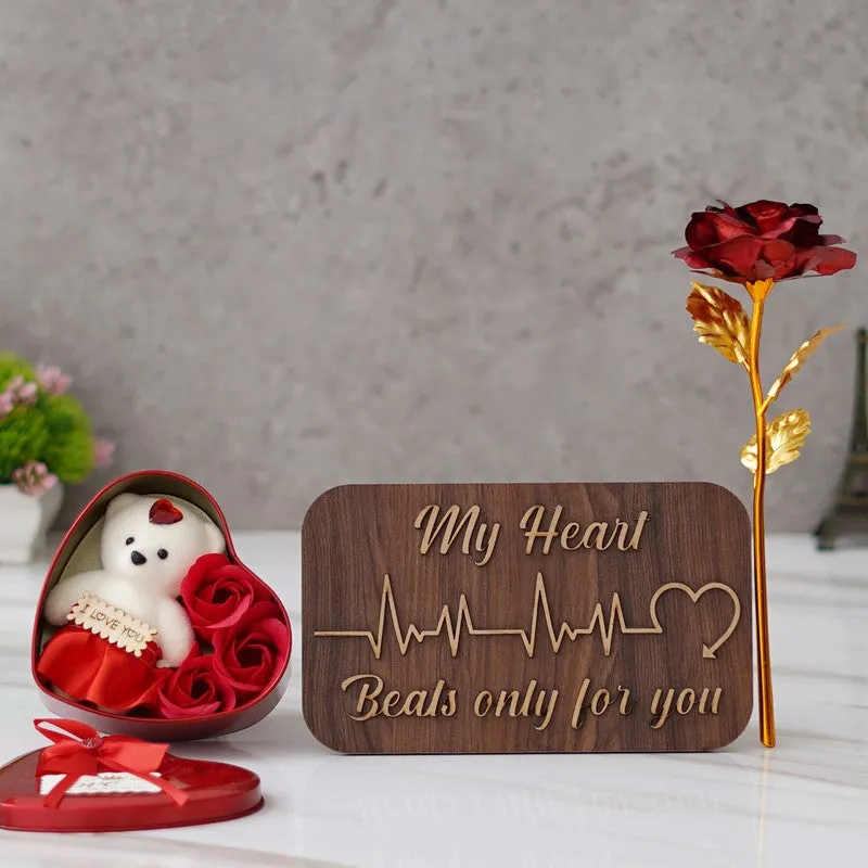 Red heart-shaped gift box with teddy, wooden plaque and metallic rose stem