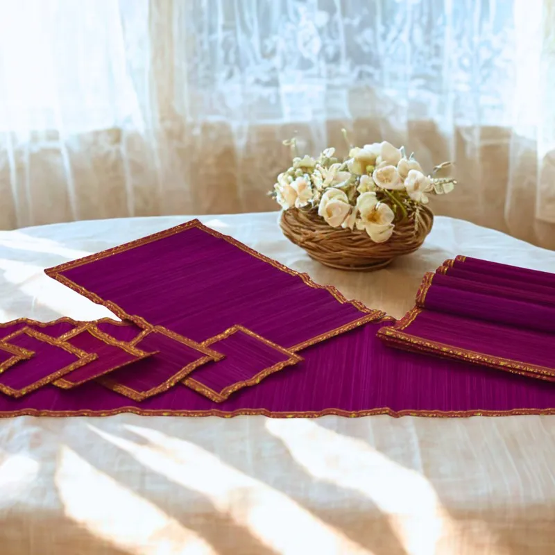 Pink table mats displayed on a light table with a floral basket