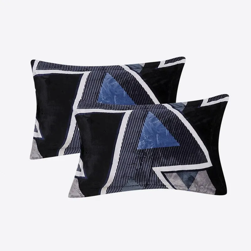 Two matching pillow covers with blue and black geometric triangle design