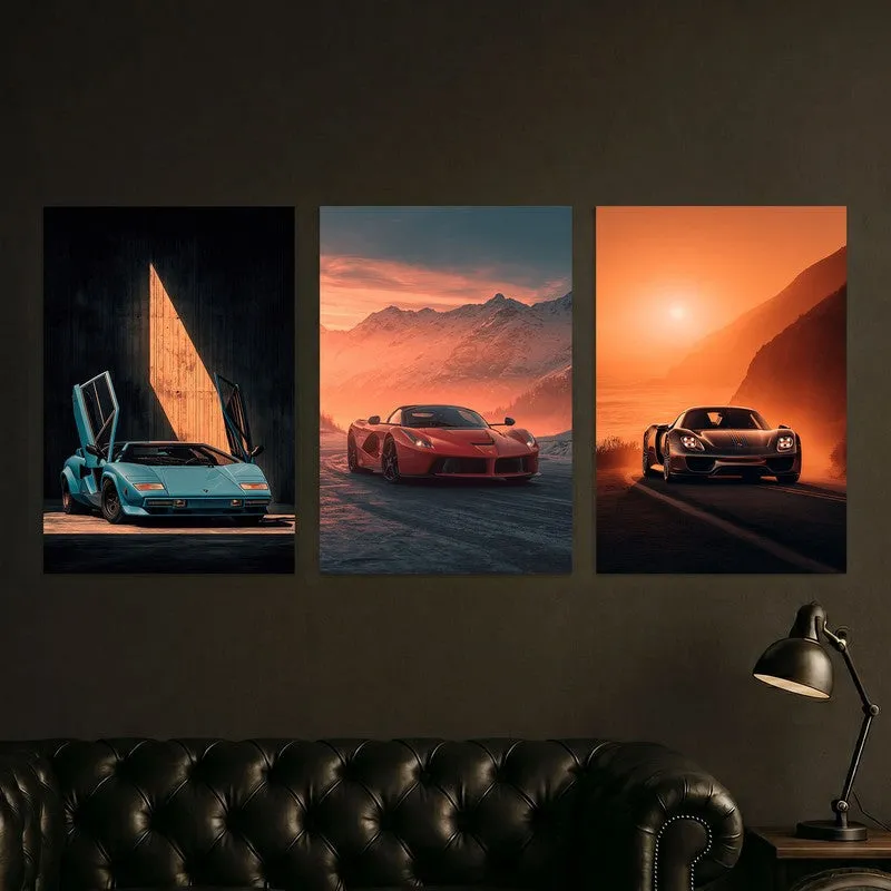 Three vertical car posters styled above a dark leather sofa