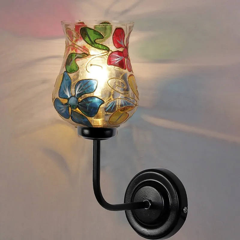 Lit multicolour glass wall lamp with floral motif and black iron base