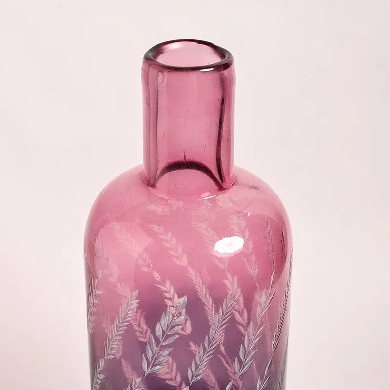 Close-up of the neck and etched leaf detail on the pink glass vase