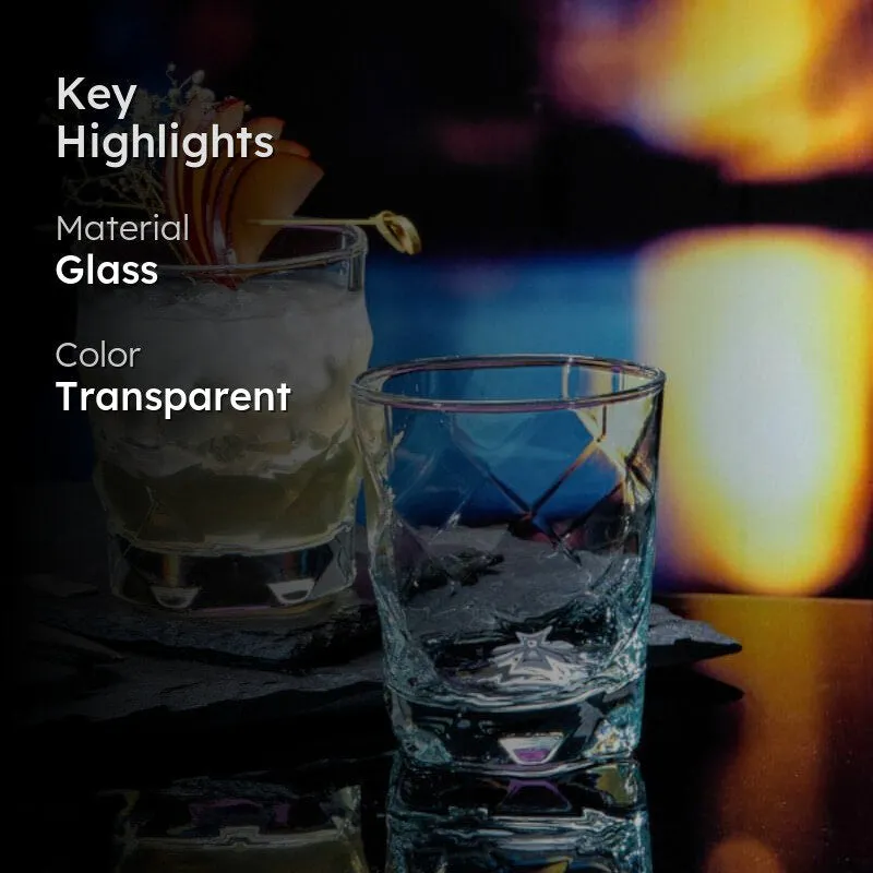 Transparent faceted glass tumbler on a dark tabletop with another drink behind