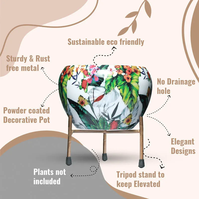 Close view of a tropical print planter on a metal tripod stand