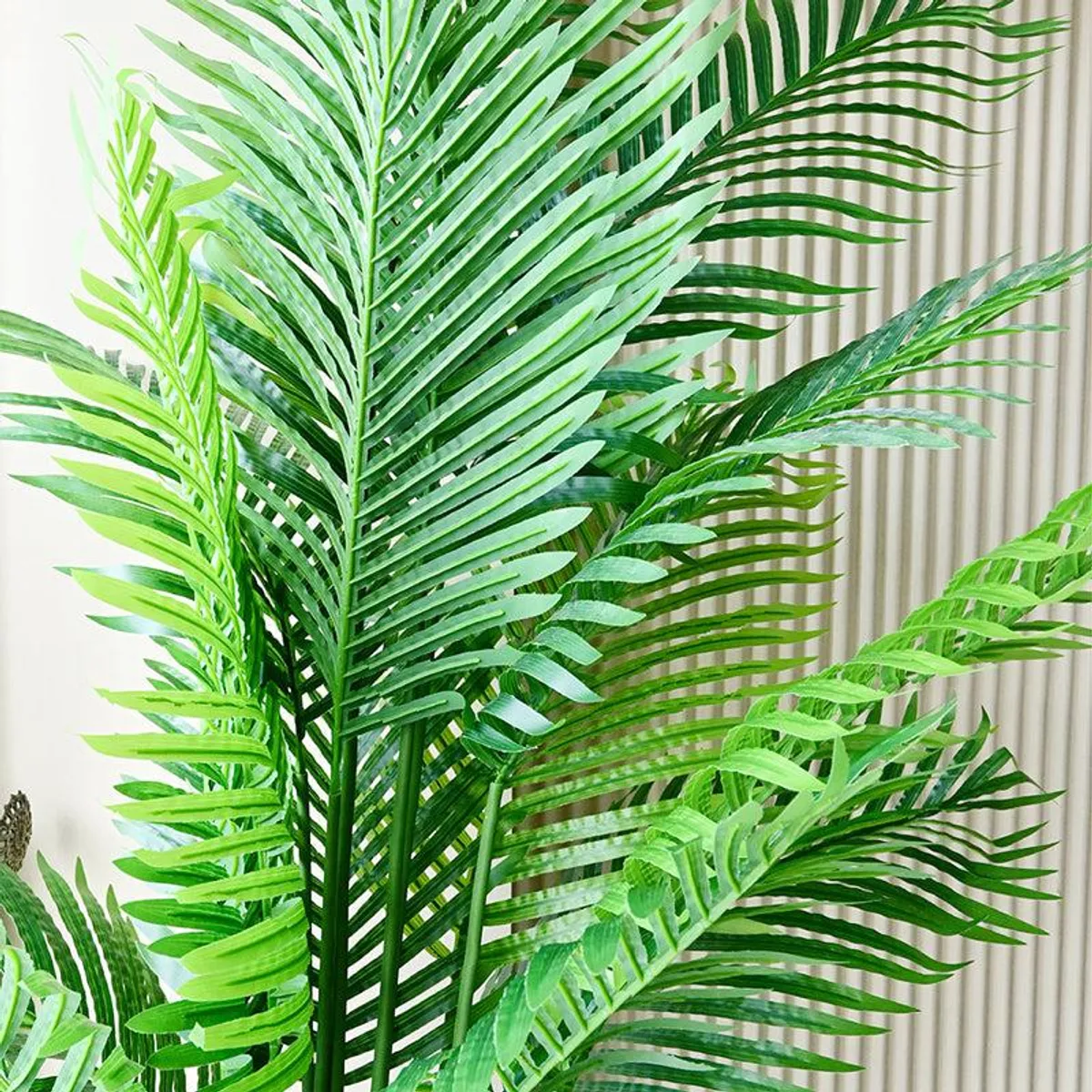 Close-up of layered green artificial palm fronds