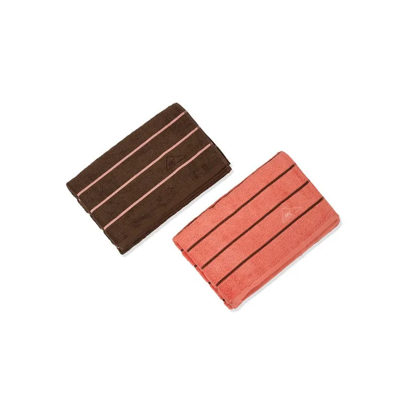 Brown and orange striped bath towels displayed separately on a white background