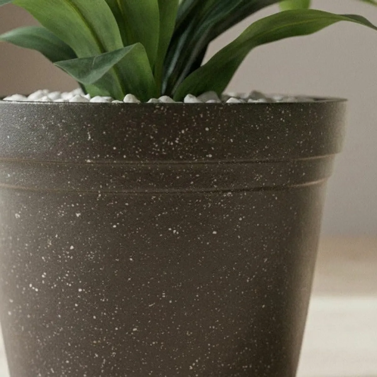Close-up of the planter's fine white speckled surface