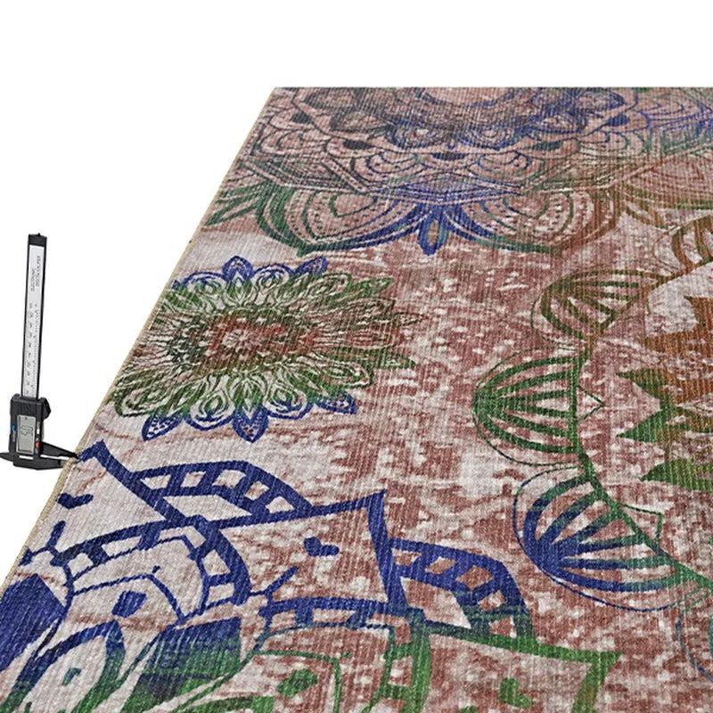 Angled close-up of the carpet surface with multicolour ethnic pattern