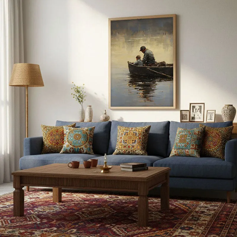 Natural brown framed wall art displayed above a blue sofa in a living room