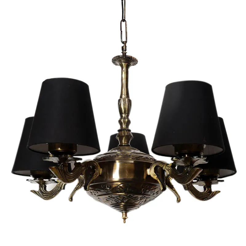 Close-up of the ornate golden antique lamp body and black shades